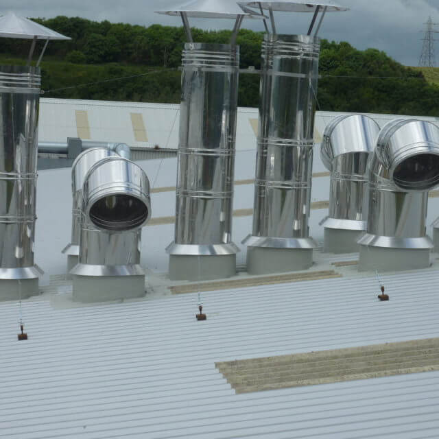 Roof upstands and access hatches on top of a white roof