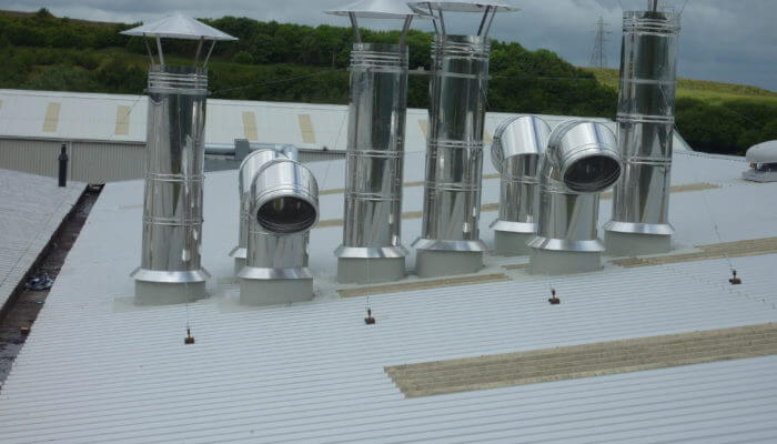 Roof upstands and access hatches on top of a white roof